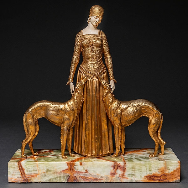 "Dama con Galgos" Figura Crisolefantina realizada en bronce dorado y marfil. Siglo XX