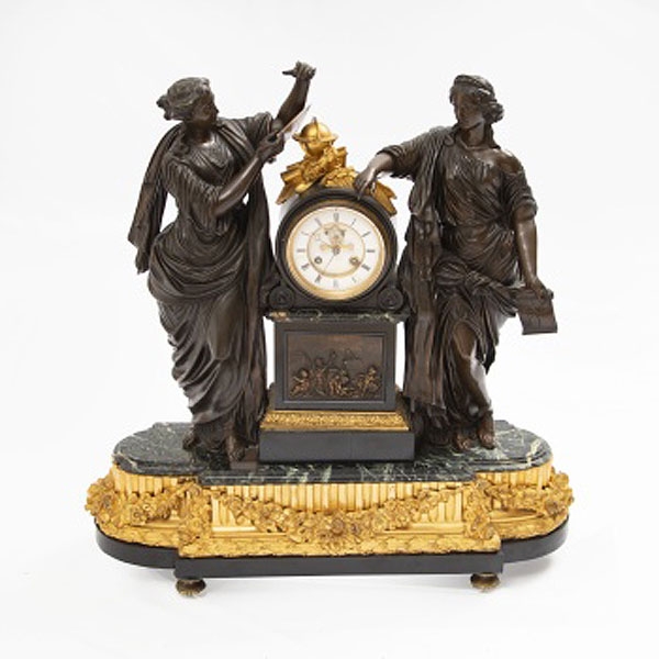 Reloj de sobremesa en bronce dorado y patinado  Época Napoleón III. Francia.  Época: S. XIX