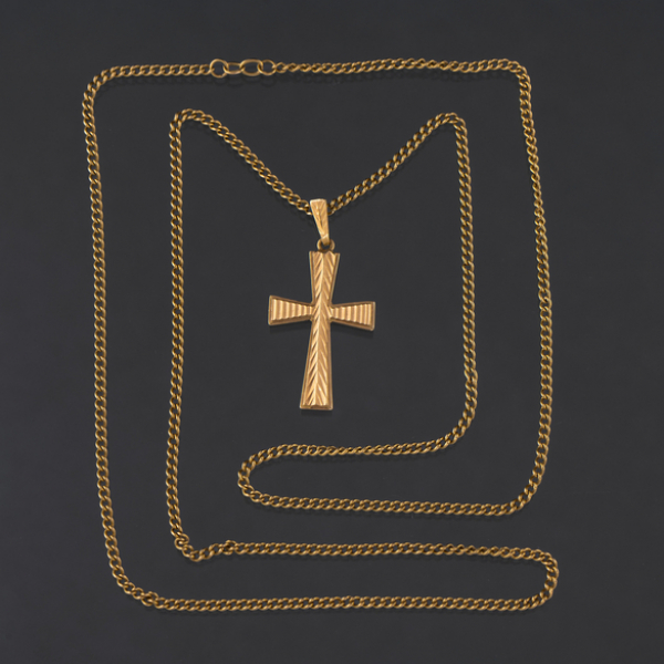 Cadena de eslabones en oro amarillo de 18 kt con colgante en forma de cruz.