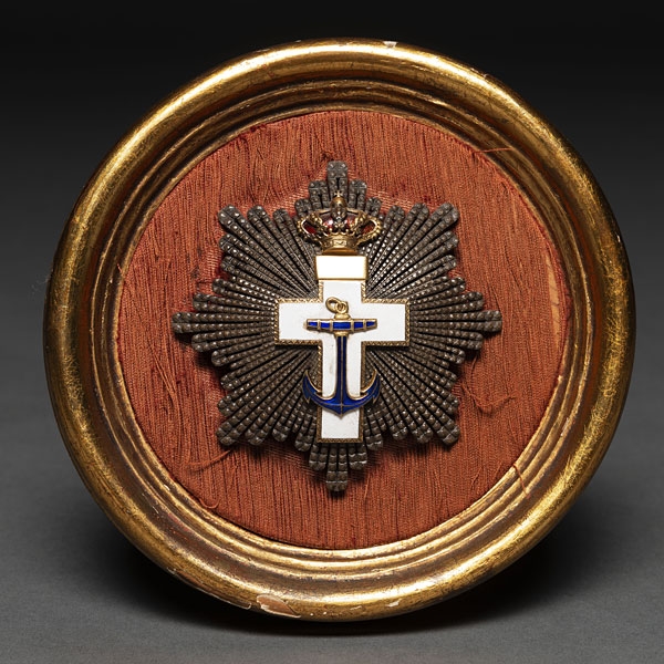 Medalla conmemorativa realizada en bronce, esmalte azul, blanco y rojo.