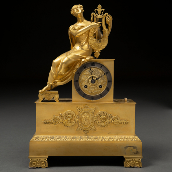 &quot;Alegoría de la música&quot; Reloj de sobremesa época restauración en bronce dorado del siglo XIX