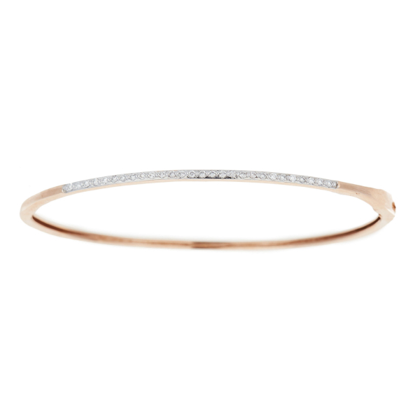 Pulsera esclava en oro bicolor con frente de diamantes talla brillante.