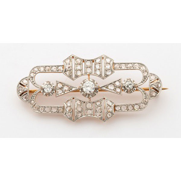 Broche en oro blanco y amarillo con 3 diamantes talla brillante