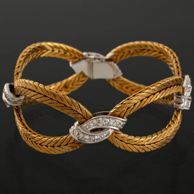 Pulsera articulada de eslabones en oro amarillo y oro blanco de 18kt con brillantes.