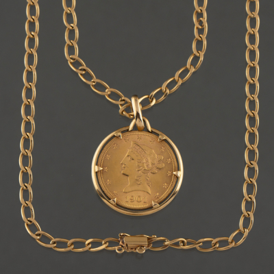 Cadena de eslabones en oro amarillo de 18 kt con moneda de 10 dolares americanos del año 1901.