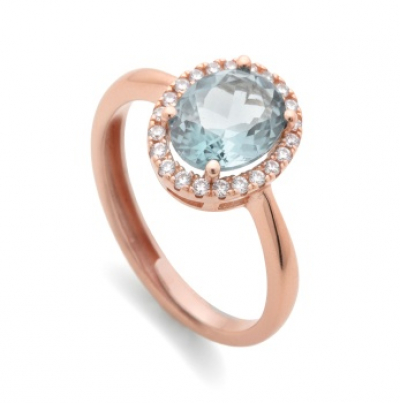 Sortija en plata rosa con aguamarina central y orla de zafiros blancos.