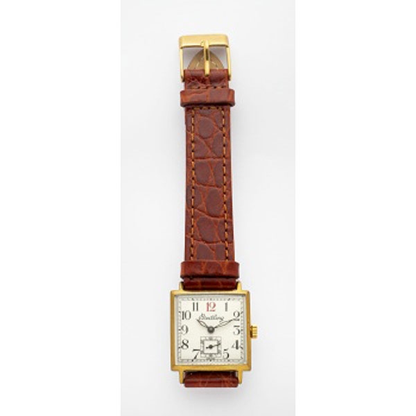 Reloj de caballero marca Breitling con caja en acero y chapado, esfera blanca, números árabes y correa en piel marrón.