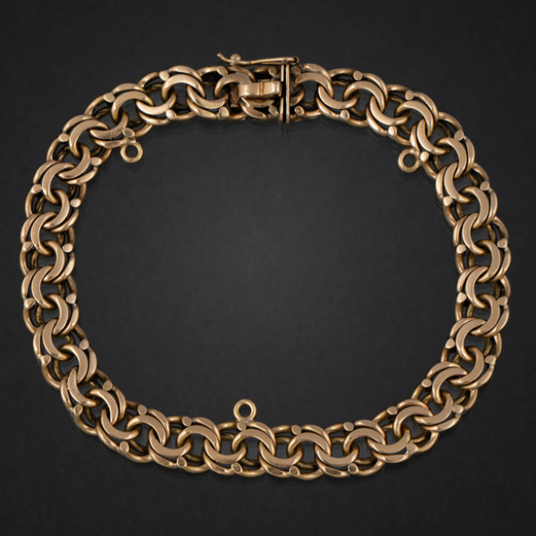 Pulsera de doble eslabón barbado en oro amarillo de 18 kt.