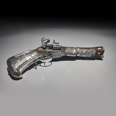 Pistola Trabuco de cintur&oacute;n Miquelet - Lock ornada en plata mexicana, Nueva Espa&ntilde;a, siglo XVIII.