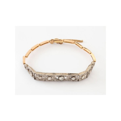Pulsera antigua Época Art Deco en oro amarillo y oro blanco con 7 diamantes talla brillante centrales y diamante  