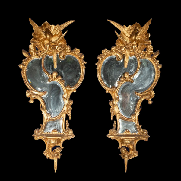 Pareja de espejos tallados y dorados en oro fino. Escuela Europea. Siglo XIX.