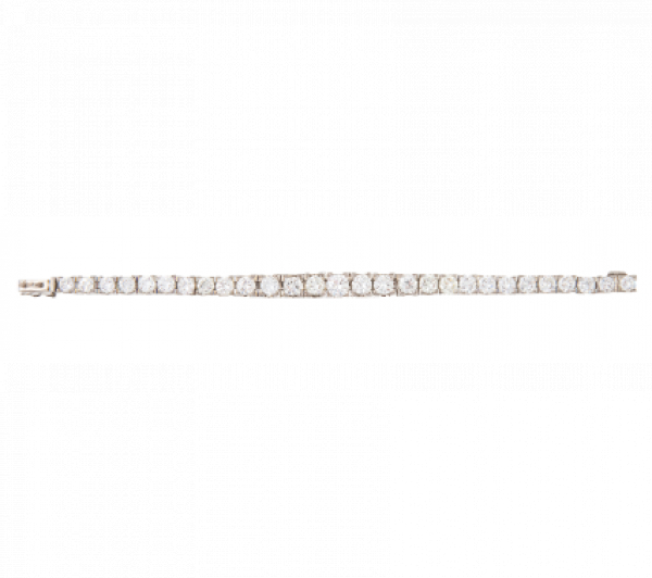 Pulsera de brillantes con tamaño creciente hacia el centro, engastados en marcos cuadrangulares articulados entre sí.   En oro blanco de 18K.