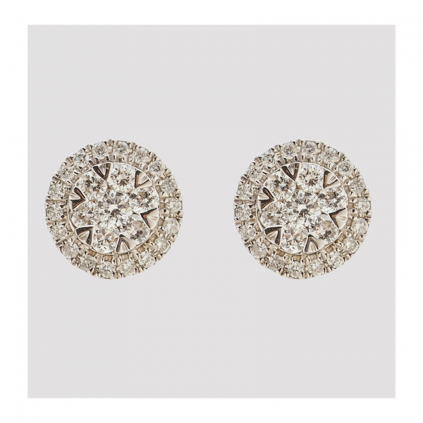 Pendientes en oro blanco con rosetón y orla de diamantes talla brillante.