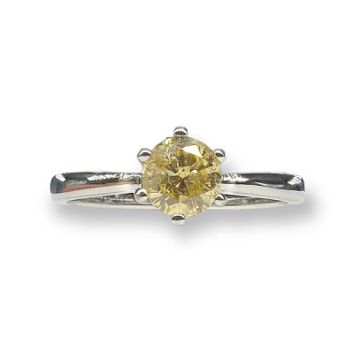 Solitario en platino con diamante talla brillante de aprox. 1ct en color fancy yellow.