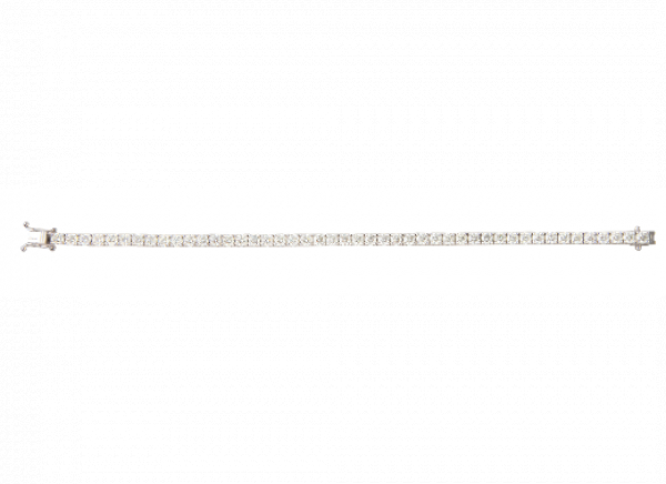 Pulsera rivi&egrave;re de 45 brillantes, engastados en garras articuladas.   En montura de oro blanco.