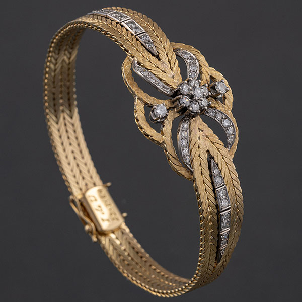 Pulsera en oro amarillo y oro blanco de 18 kt con brillantes.