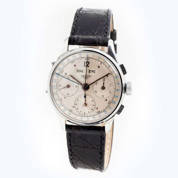 Reloj cronógrafo vintage, cab., suizo HEUER, triple calendario (mes, día del mes y día de la semana), en caja original de acero 
