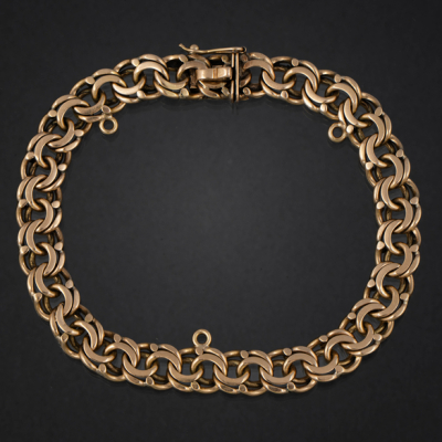 Pulsera de doble eslab&oacute;n barbado en oro amarillo de 18 kt.