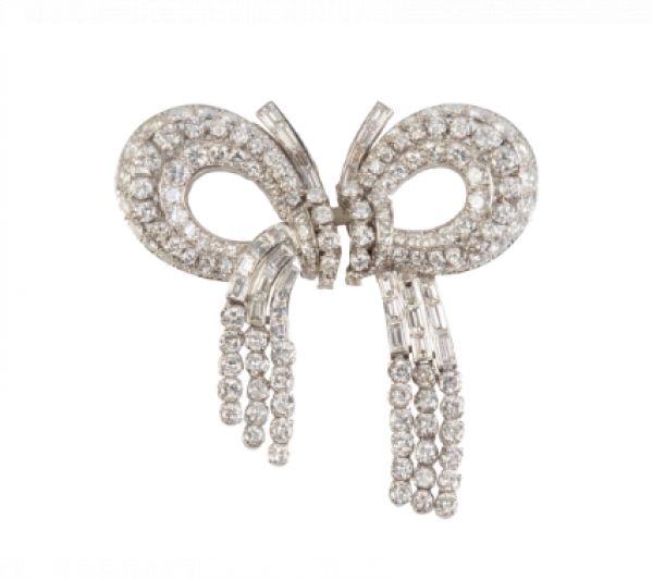 Elegante broche lazo doble clip años 50, de brillantes y baguettes con cascadas de chatones de brillantes colgantes. 