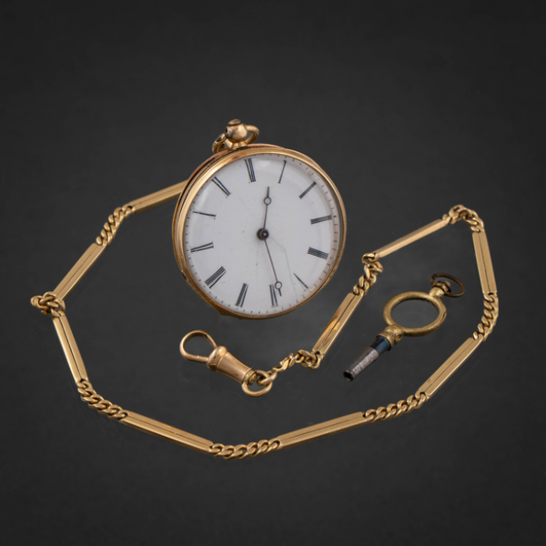 Reloj de bolsillo de dama con llave en oro amarillo de 18 kt con leontina.