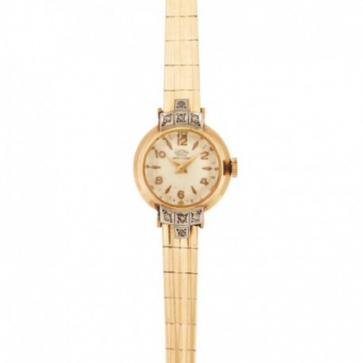 DOGMA, reloj de pulsera para señora en oro y vistas en platino, c.1940. 