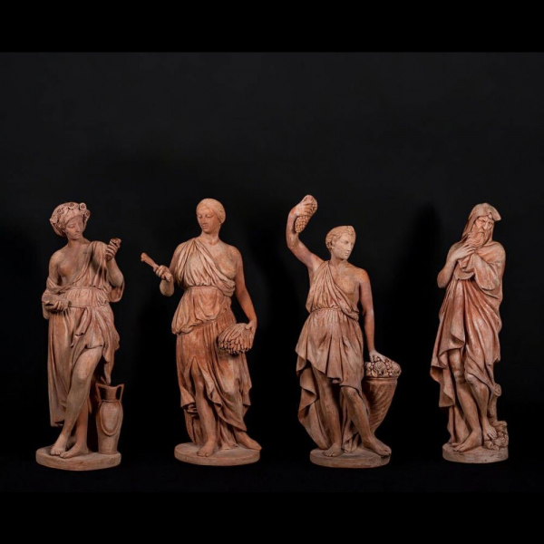Lote de 4 esculturas en terracota de Impruneta representando las 4 estaciones, Italia, siglo XX.