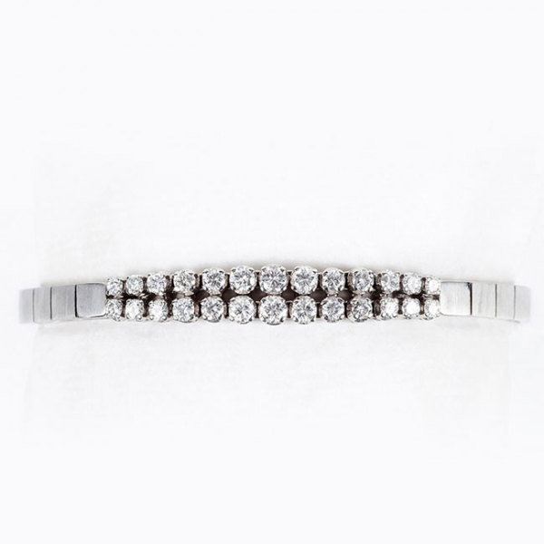 Pulsera vintage en sólida montura oro blanco 18 K y centro en doble fila riviere de limpios y blancos diamantes 