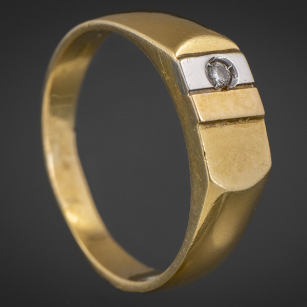 Anillo en oro amarillo y oro blanco de 18 kt con brillante.
