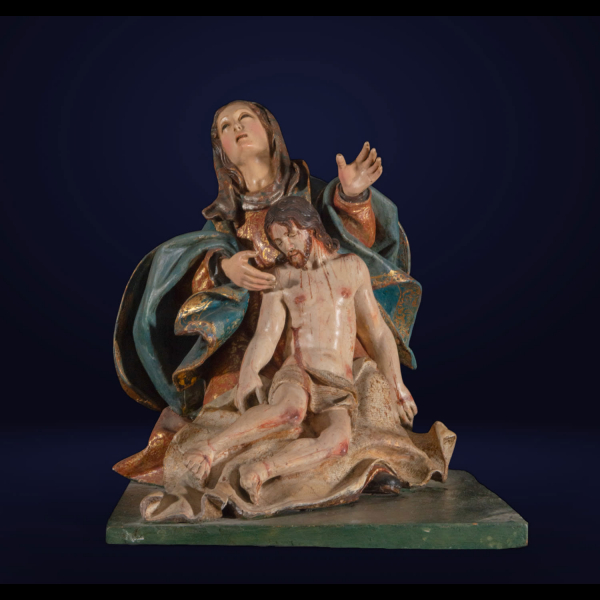 Trabajo colonial de la Nueva Granada del siglo XVIII, Pietà.   Grupo en madera policromada y dorada, ojos en cristal, con peana de la misma época.