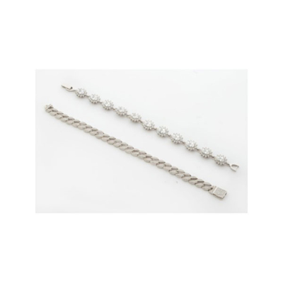 Lote compuesto por 2 pulseras en plata y circonitas representando flores y calabrotes.