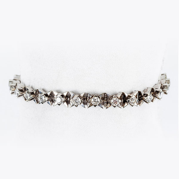 Pulsera vintage en sólida montura de oro blanco 18 K con fila central de limpios y blancos diamantes, talla brillante