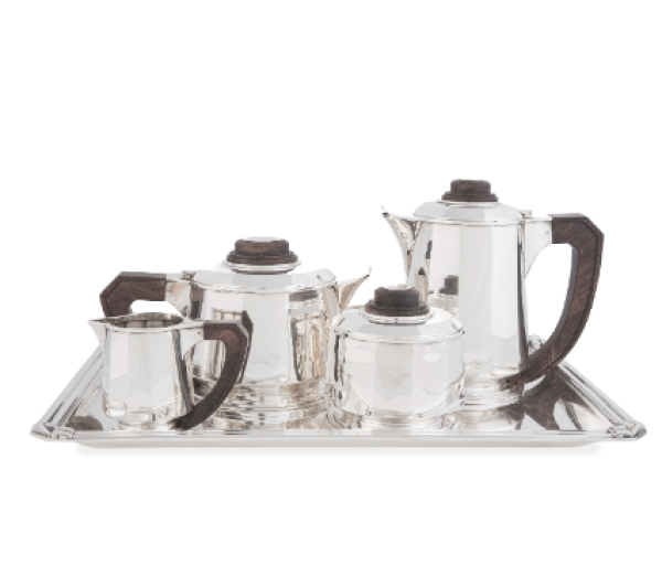 Jean Elys&eacute;e Puiforcat (1897-1945)*.  Juego de caf&eacute; y t&eacute; Art-Dec&oacute; de plata con asas y remates de madera de palo de rosa. Ley 950.  