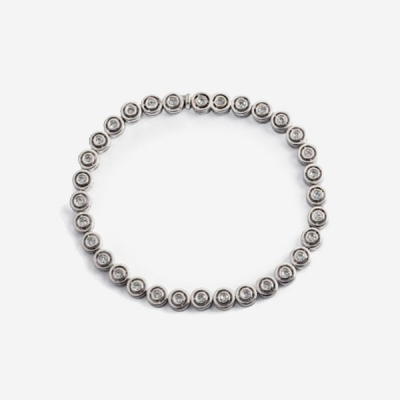 Riviere de chatones en oro blanco y diamantes talla brillante con un peso total de 1,2 cts. aprox.