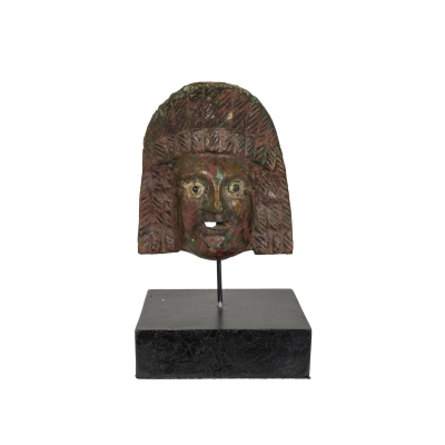 Aplique romano en bronce con representaci&oacute;n de m&aacute;scara de teatro. Periodo Alto Imperial, I-II d.C.