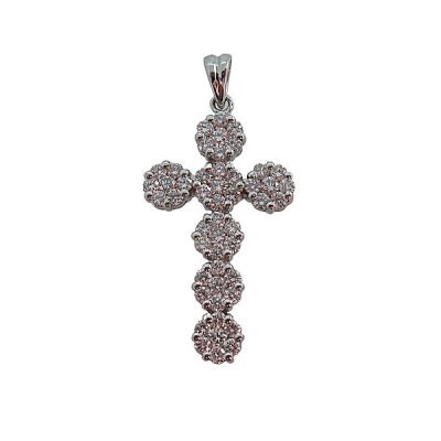 Cruz en oro blanco de 18k formada por siete rosetones de diamantes talla brillante