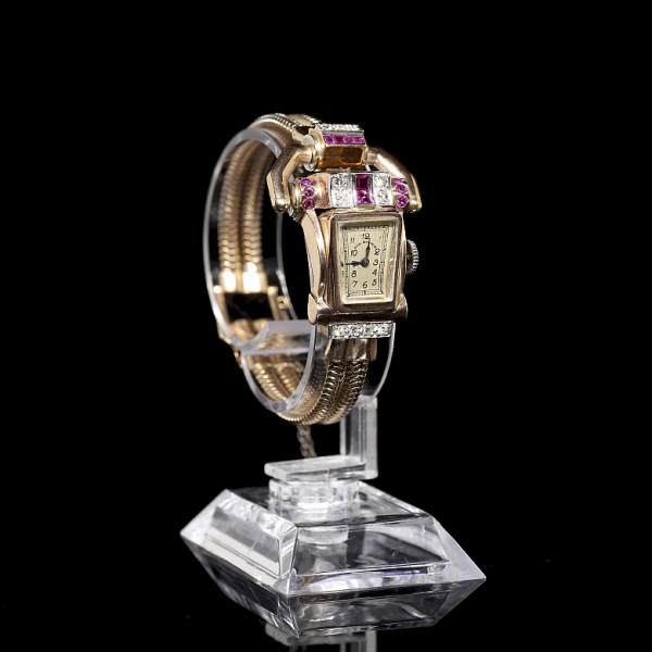 Reloj vintage del relojero suizo Paul Ditisheim, de oro con diamantes y rubíes. Años 40.