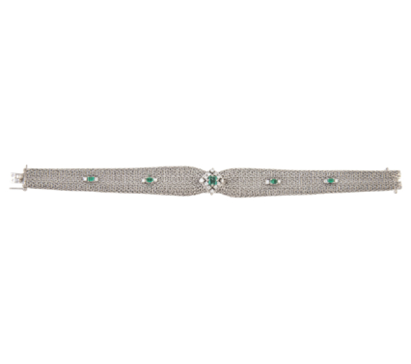Pulsera a&ntilde;os 50 en malla flexible de oro blanco anudada en el centro, y decorada con esmeraldas y brillantes  