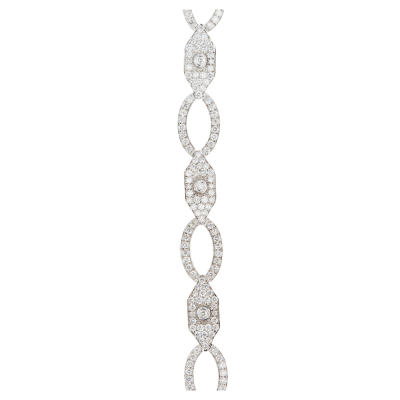 Pulsera en oro blanco con eslabones ovales y exagonales cuajados de diamantes talla brillante.