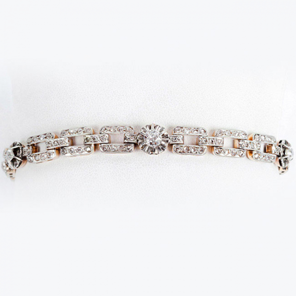 Pulserita antigua, estilo art-decó, en oro amarillo 18 K con cinco centros de limpios y blancos diamantes, talla brillante antigua 