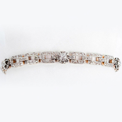 Pulserita antigua, estilo art-decó, en oro amarillo 18 K con cinco centros de limpios y blancos diamantes, talla brillante antigua 
