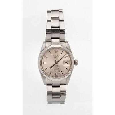Reloj de caballero marca Rolex en acero con caja y pulsera Oyster Perpetual Date. Esfera gris, palos y calendario.
