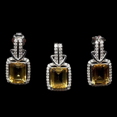 Juego de colgante y pendientes en oro blanco de 18K con citrinos y diamantes. 