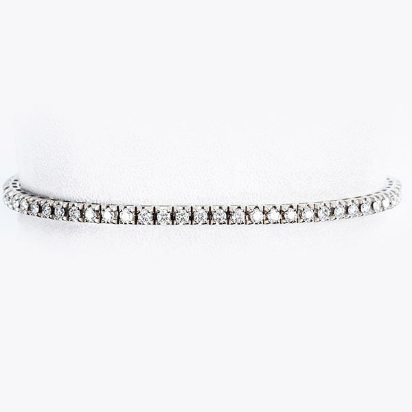 Pulsera rivière, en oro blanco 18 K, con fila articulada de limpios y blancos diamantes, talla brillante