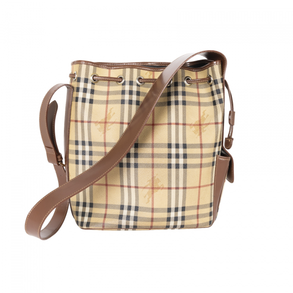 BURBERRY. Bolso tipo &laquo;bucket&raquo; con estampado Novacheck con cierre de cord&oacute;n y asa en cuero marr&oacute;n chocolate. En perfecto estado.