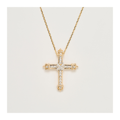 Colgante diseño cruz en oro con diamantes talla brillante engastados en garras y carril. Peso diamantes: 1,30 ct. aprox.